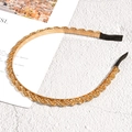 Cerchietto minimalista in metallo dorato con design intrecciato e punte protettive nere - Cerchietto a Catena Intrecciata