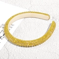 Detail of yellow rhinestone padded headband featuring sparkling faceted crystals - Yellow