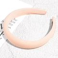 Detailed view of apricot padded sponge headband with twill fabric on stone background - Light Pink