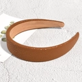 Detail of brown textured headband with granular faux leather finish and soft non-slip lining - Brown