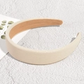 Detail of cream beige headband with pebble grain texture and soft faux suede inner lining - Off White