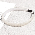 Close-up of white beaded headband with rows of crystals and non-slip black ends - Vintage Beaded Style / White