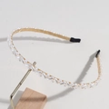 Elegante gouden haarband met witte ronde en ovale parels in een golvend patroon - Rijstparel Stijl