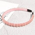 Detailed macro view of pink beaded headband with satin lining and anti-slip ends - Vintage Beaded Style / Pink