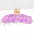 Lavender purple woven chain style hair claw clip for women on a magazine background - Purple
