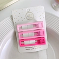 Dettaglio di fermagli rettangolari sfumati rosa fissati su un supporto decorativo - Quadrato / Rosa