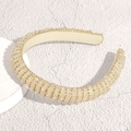 Detail of champagne gold wide headband with crystal beads and sparkling rhinestones - White