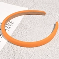 Serre-tête éponge orange vif avec doublure antidérapante sur fond blanc texturé - 1.2cm / Orange