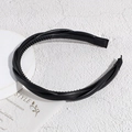 Detalle de diadema de cuero trenzado negro que muestra los dientes antideslizantes internos - Negro