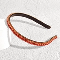Detail shot of golden baroque headband with dual rows of sparkling red rhinestones - Thin Rhinestone Red