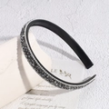 Detail view of Baroque headband with smoked gray crystals and non-slip inner teeth - Transparent Gray