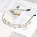Elegant baroque headband with crystal beads and flowers on a white display stand - White
