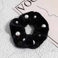 Close-up of black fuzzy plush scrunchie with elegant faux pearl embellishments - Black