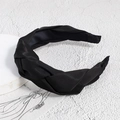Detailed view of black woven braid headband with soft satin texture and knot design - Black