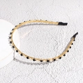 Detail of a thin gold metal headband featuring alternating black beads and white faux pearls - Black