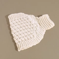 Macro detail of creamy white knitted ear warmer featuring textured thick crochet patterns - White