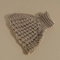 Macro detail of the thick brown wave knit texture on a warm winter headband - Brown
