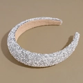 Detailed close-up of padded headband featuring silver crystals and white pearls - Gray