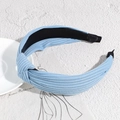 Light blue knotted headband featuring a soft ribbed knit texture and comfortable wide fit - Haze Blue