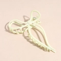 Detail view of a matte creamy yellow butterfly hair claw clip with metallic spring - White Bow Claw Clip