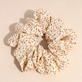 Dettaglio del tessuto di un grande elastico beige con motivo leopardato marrone - Beige
