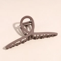 Close-up of matte coffee brown large hair claw clip with cross spiral design and metal spring - Dark Coffee Y-Shaped Clip