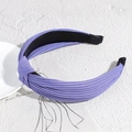 Purple ribbed knit knotted headband with elegant twist design for women's hair styling - Deep purple