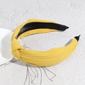 Fashionable bright yellow ribbed fabric knotted headband with soft inner lining - Turmeric