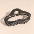 Close-up of black glossy acetate hair claw clip showing golden metal spring and teeth - Cloud Shape Black