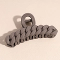 Macro detail of matte dark brown hair claw clip with chain link design on light beige background - Braided Style / Brown