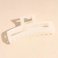 Close-up of cream acetate claw clip with durable metal spring and jagged teeth - Square White