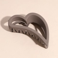 Close-up of matte mocha brown hollow heart hair claw clip with smooth frosted texture - Heart Style / Brown