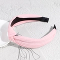 Pink ribbed fabric knotted headband featuring a stylish top cross design for women - Light Pink