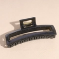 Detail of grey acetate hair claw clip showing shiny texture and strong metal spring - Square Gray