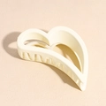 Detail of matte cream heart-shaped hair claw clip with smooth frosted finish and rounded teeth - Heart Style / White