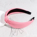 Chic pink knotted headband featuring pleated fabric texture and a comfortable wide band design - Deep Pink