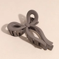 Detail view of mocha brown matte bow hair claw clip with sturdy metal spring - Bow Style / Brown