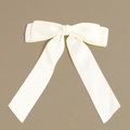 Close-up of elegant cream ribbon bow hairclip with textured satin fabric detail - Hair Bow / White