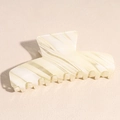 Detail of a large cream and olive green striped acetate shark hair claw clip accessory - Square White