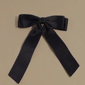 Close-up of black velvet bow hair clip showing premium silk texture and elegant ribbons - Hair Bow / Black