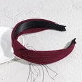 Knotted wide headband in burgundy ribbed fabric with a stylish twisted knot design - Burgundy