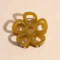 Translucent amber flower hair claw clip with golden metal spring on a textured background - Translucent Yellow