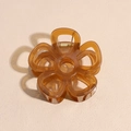 Detail of amber brown resin flower hair claw clip with golden metal spring and hollow design - Translucent Brown