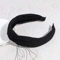 Fashionable black knotted headband featuring ribbed knitted texture and elastic wide design - Black