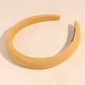 Detail of mustard yellow sponge headband showing fine twill knitted texture and inner non-slip pad - Yellow