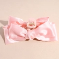 Detail shot of the large pink satin bow hair claw clip showing smooth fabric texture - Pink
