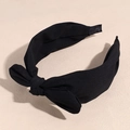 Detail of a black chiffon bow headband with a wide textured fabric and vintage knot design - Black