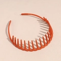 Vue détaillée du serre-tête orange montrant la structure ondulée antidérapante et dentelée - Rouge Orangé