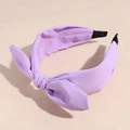Close-up of lilac chiffon bow headband showing soft fabric texture and pleated finish - Purple