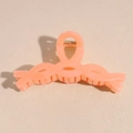 Detail view of large peach hair claw clip with a twisted weave design and matte finish - Matte Orange Red